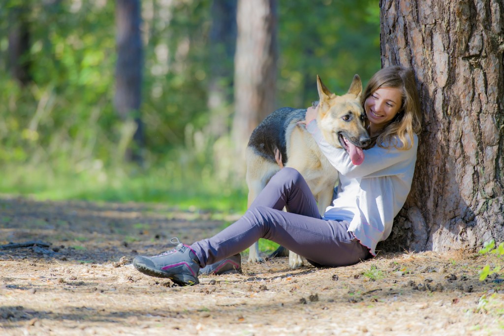 Women With Dog In Forest iStock_000030448978_Medium